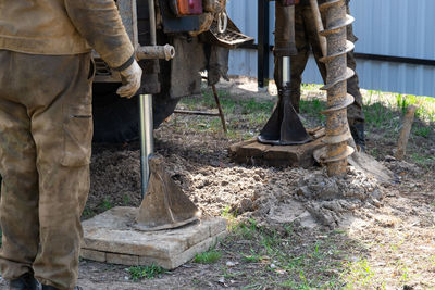 Low section of man working at construction site