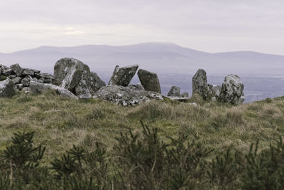 Standing stones of a portal tomb at rathcoran, a neolithic hillfort