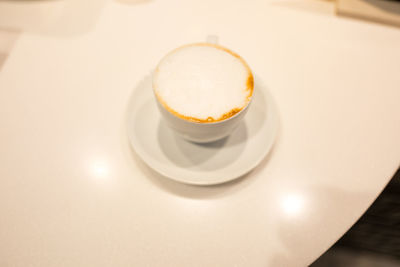 High angle view of coffee cup on table