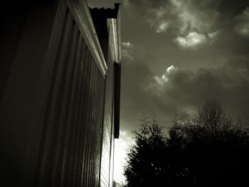 Low angle view of building against cloudy sky