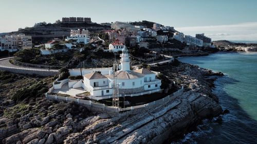 High angle view of town by sea