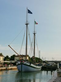 Boats moored at harbor