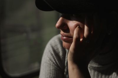 Close-up of woman wearing cap