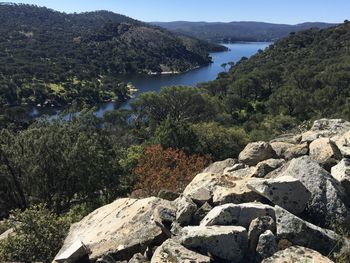 Scenic view of river amidst mountains