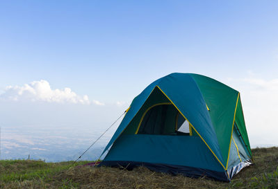 Tent on field against sky