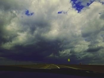 Storm clouds over road