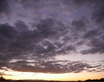 Low angle view of dramatic sky during sunset