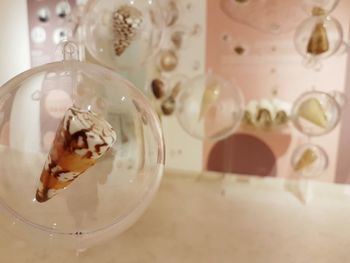 Close-up of cat on table at home