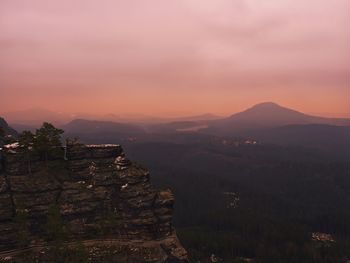 Scenic view of landscape against sky during sunset