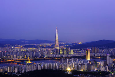 Illuminated buildings in city at night