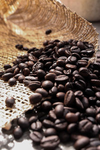 A nice grams of black coffee beans harvested to be brewed for a quality cup of coffee drink.