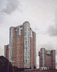 Low angle view of modern buildings against sky