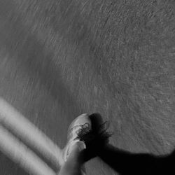 Low section of woman standing on tiled floor