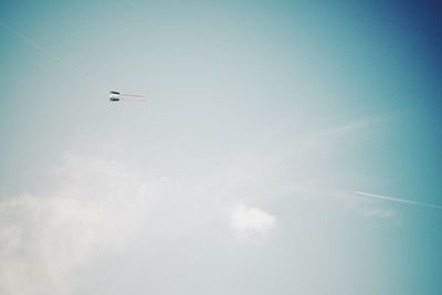 Low angle view of airplane flying in sky