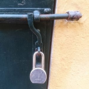 Close-up of padlock on door