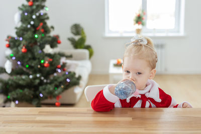 Boy playing with toy blocks on table