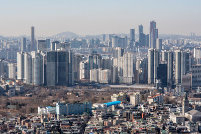 Aerial view of cityscape against clear sky