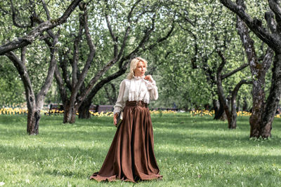 Rear view of woman standing in park