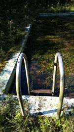 High angle view of abandoned container on grass