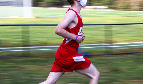 Full length of man running on grass