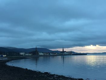 View of bridge over river against cloudy sky