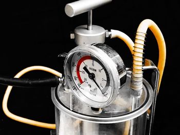 Close-up of electric lamp against black background