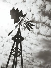 Low angle view of traditional windmill against sky