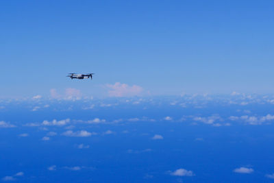 Low angle view of airplane flying in sky