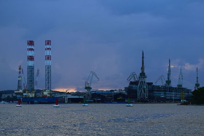 Cranes at harbor at sunrise