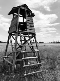 Built structure on field against sky