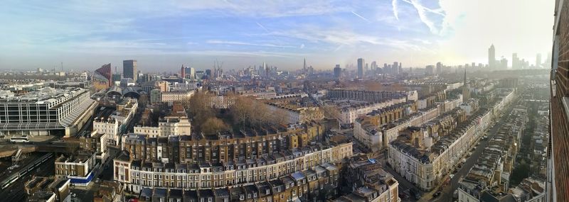 High angle view of city buildings against sky