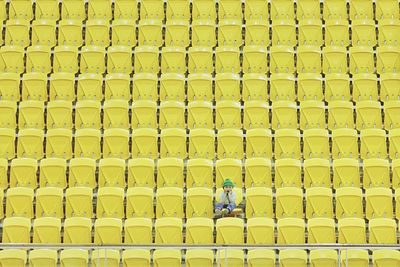 Portrait of a boy against yellow stairs