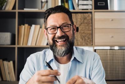 Portrait of smiling man at home