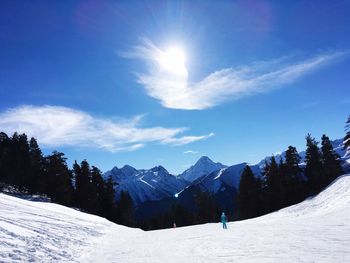 Scenic view of landscape against blue sky