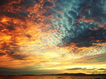 Low angle view of dramatic sky during sunset