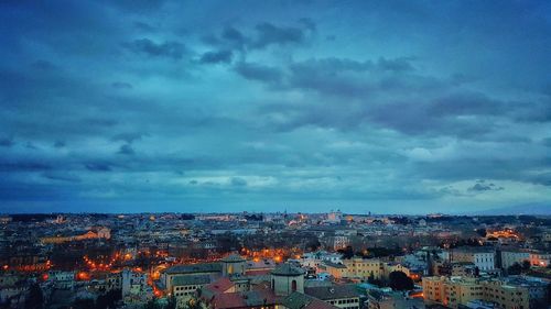 Cityscape against cloudy sky