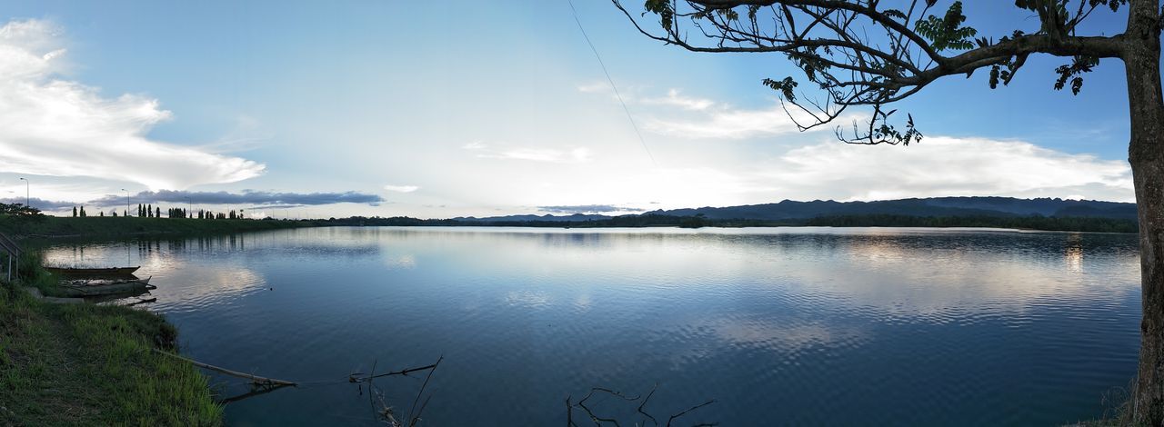 water, sky, tranquil scene, lake, tranquility, nature, beauty in nature, cloud - sky, scenics, outdoors, reflection, no people, tree, day