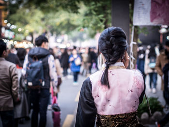 Rear view of woman on street