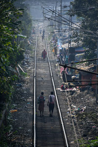 High angle view of people walking on staircase