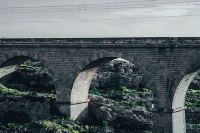 Arch bridge over field