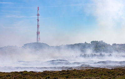 View of communications tower on field
