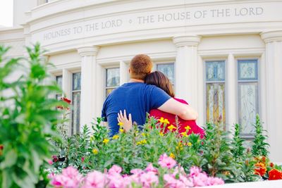 Rear view of couple looking at church