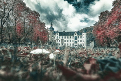 Surface level of buildings against sky during autumn