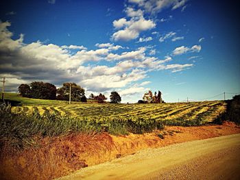Scenic view of landscape against cloudy sky