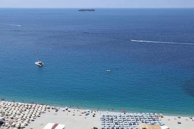 High angle view of boats at sea against sky