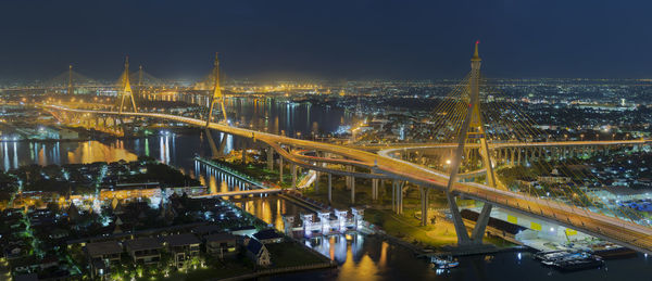 High angle view of illuminated city buildings at night