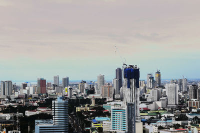 Modern buildings in city against sky