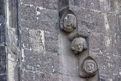 Old statue against wall