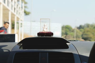 Close-up of ganesha in car