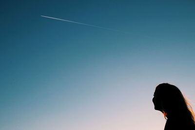 Man against clear blue sky